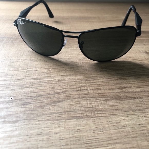 Black, slightly used RayBan Polarized Sunglasses.